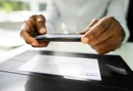 mobile Check deposit dark hands 1 Mobile Check Deposit